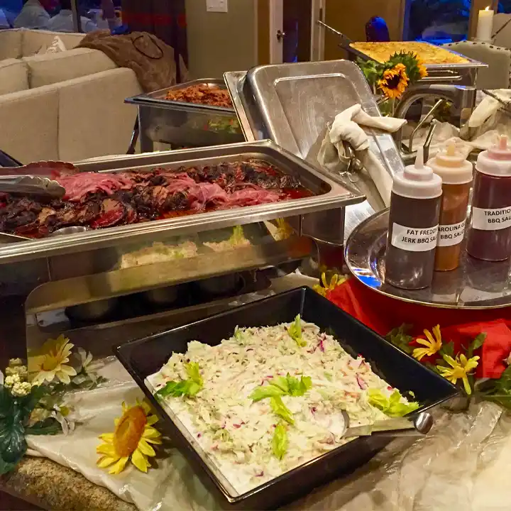 Buckeye BBQ Catering buffet with sauces and coleslaw