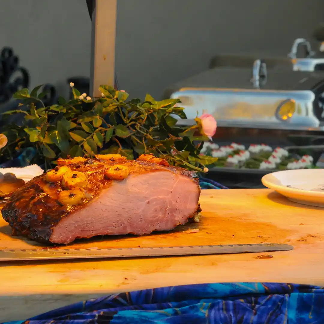 roasted ham on a blue buffet in tempe