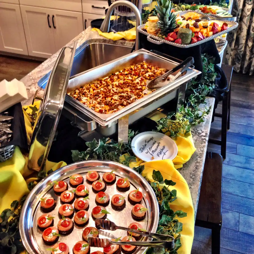 yellow peoria catering buffet on a countertop