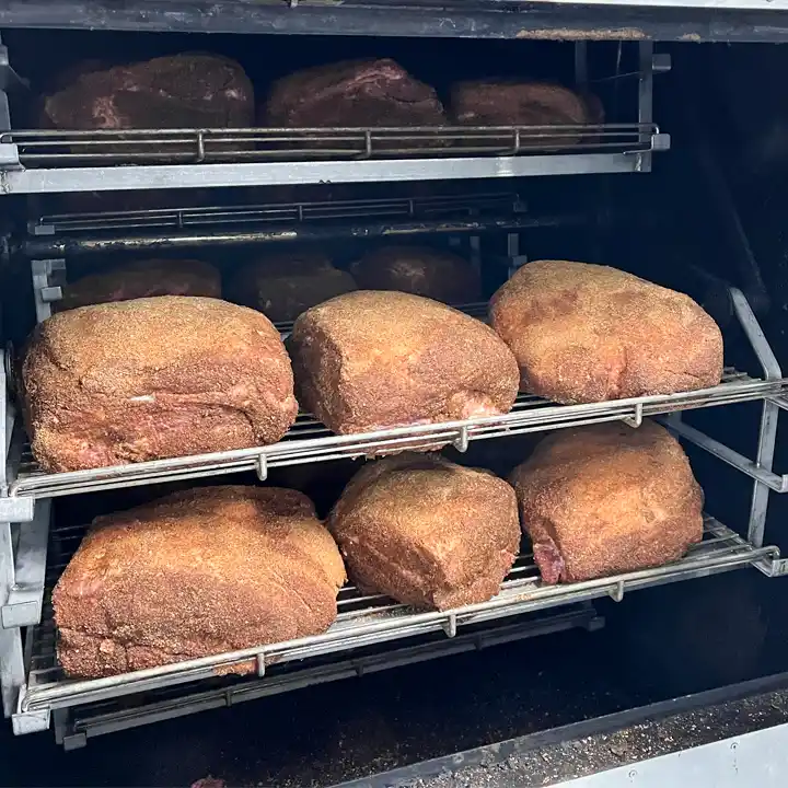 pork shoulders being smoked by Fat Freddy's Catering