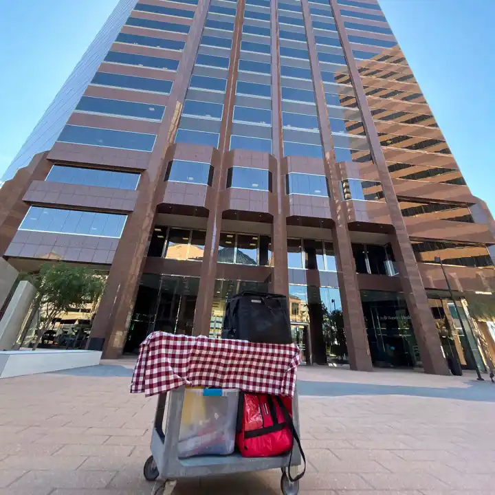 Delivery on car in front of office building in phoenix