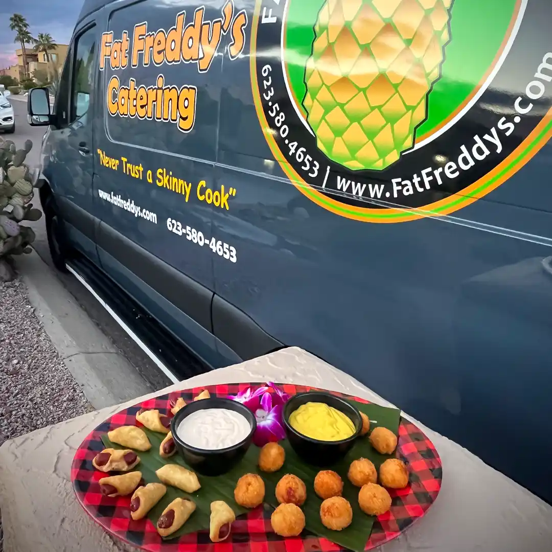 Fat Freddys Van with Plattered Hors Deuvres by Fat Freddy's Catering in Phoenix